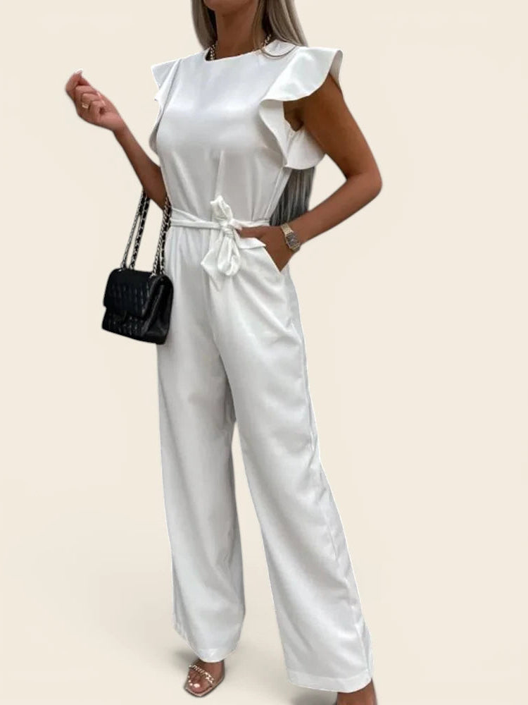 Combinaison femme chic mariage blanche. Coupe palazzo fluide avec poches pratiques et épaules structurées. Modèle La Rivoli.
