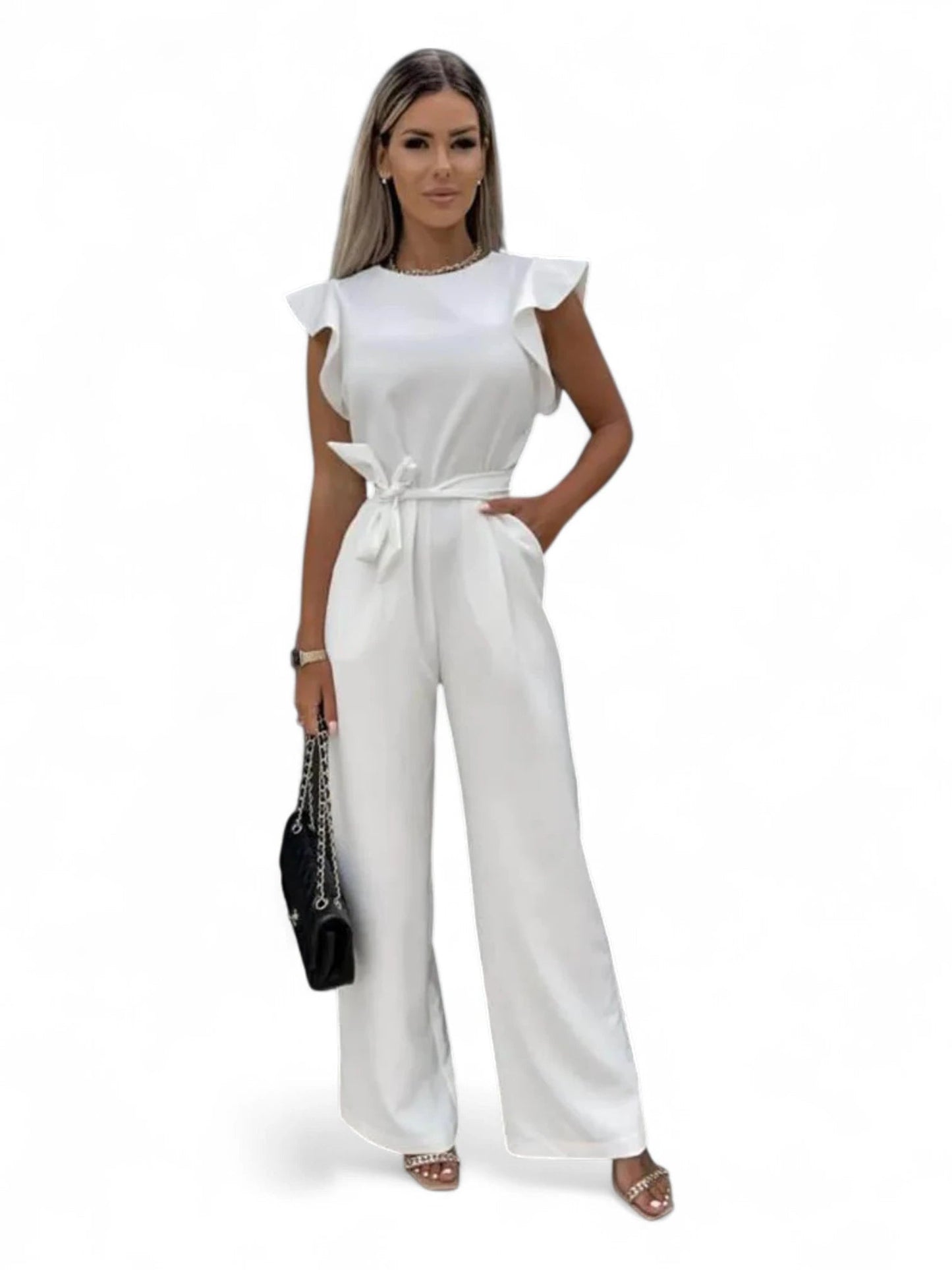 Combinaison femme chic mariage blanche. Coupe palazzo fluide avec poches pratiques et épaules structurées. Modèle La Rivoli.