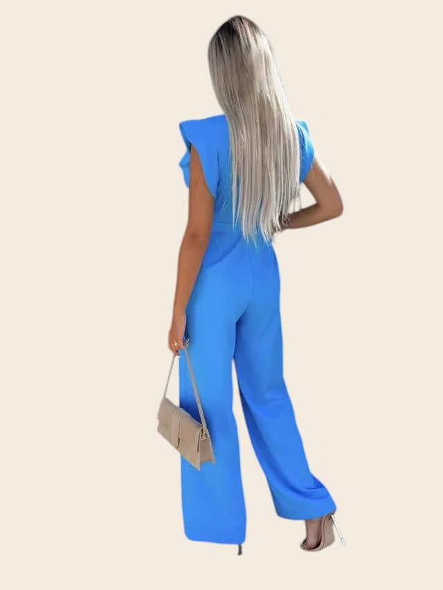 Vue de dos de la combinaison femme chic mariage bleu roi. Mise en valeur de la silhouette avec une belle fluidité.