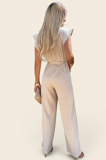 Combinaison femme chic mariage de couleur beige vue de dos. Tissu mat au tombé lourd et impeccable.
