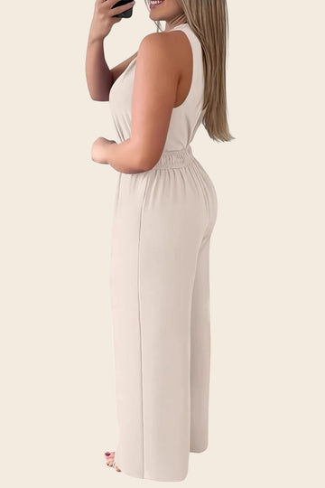 Maison de la combi - Combinaison beige col V, pantalon palazzo fluide, ceinture dorée, idéale pour mariage.