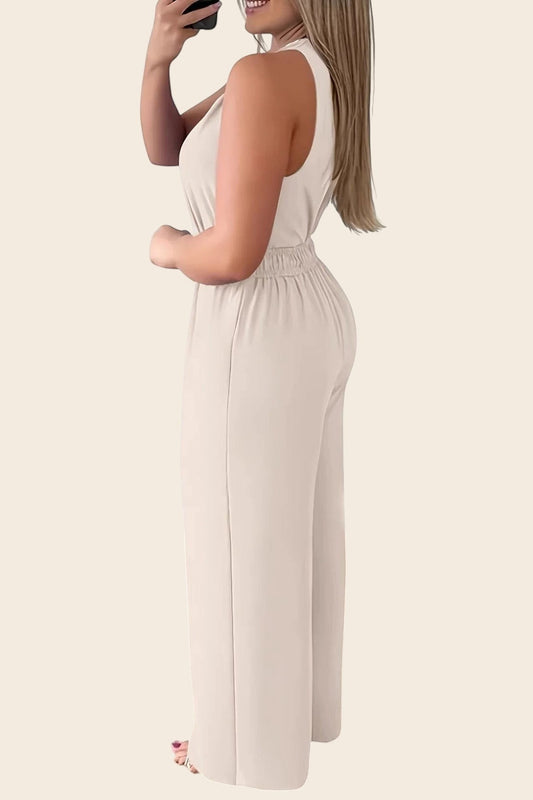 Maison de la combi - Combinaison beige col V, pantalon palazzo fluide, ceinture dorée, idéale pour mariage.