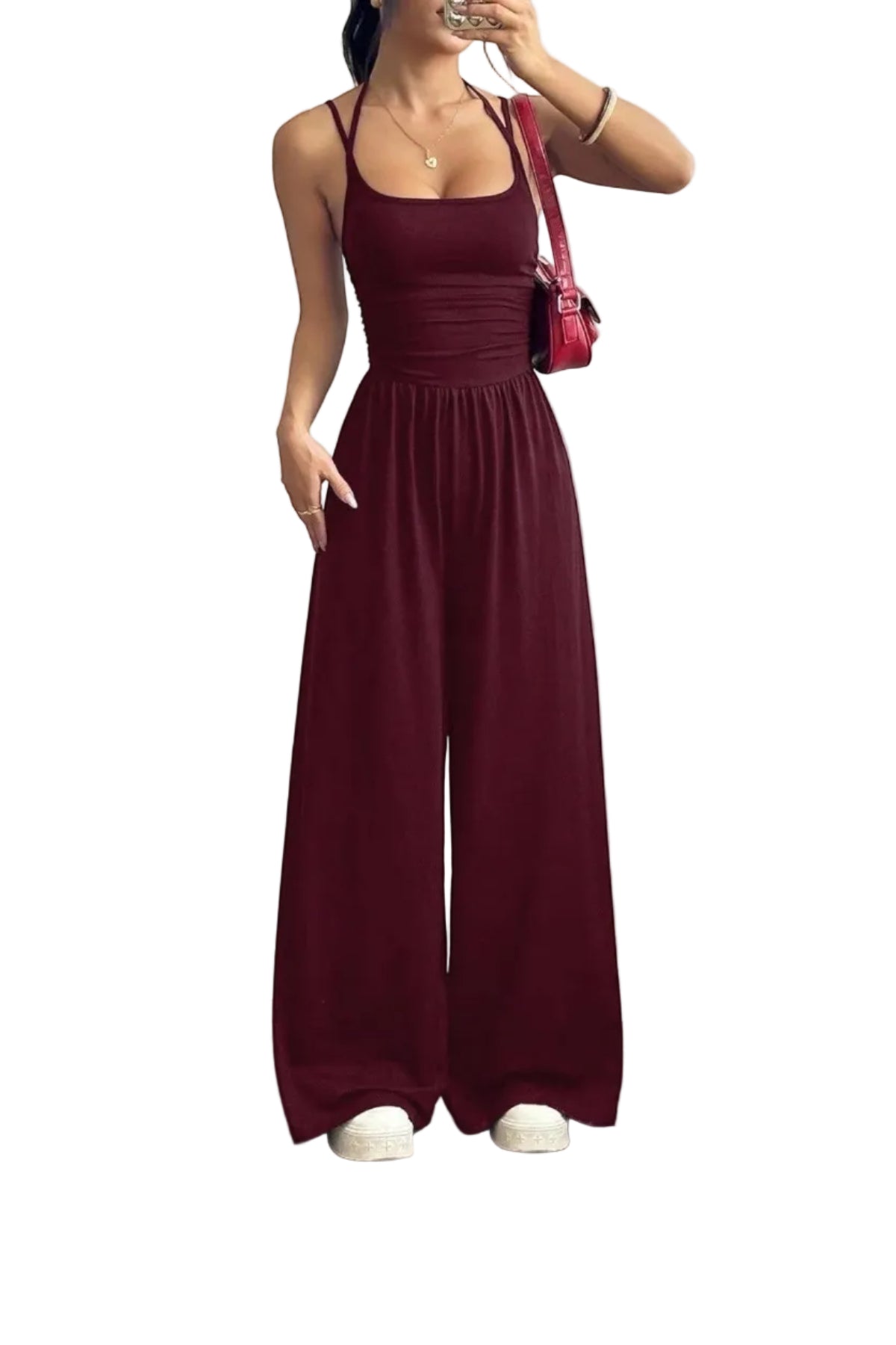Combinaison bordeaux La Esmeralda à fines bretelles spaghetti, encolure carrée, taille smockée et jambes larges. Polyester et élasthanne.