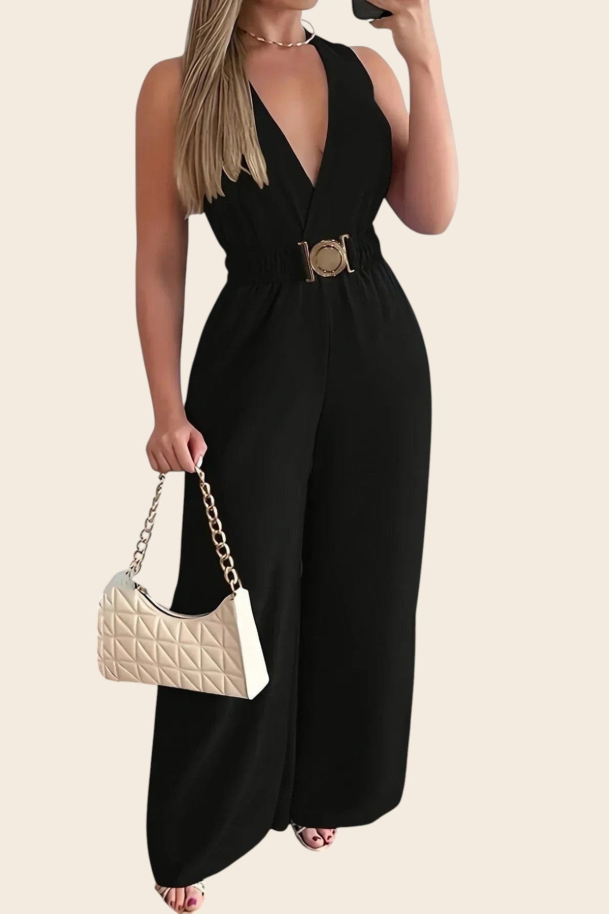 Combinaison noire élégante Maison de la Combi, col V plongeant, ceinture dorée, pantalon palazzo, polyester et coton.