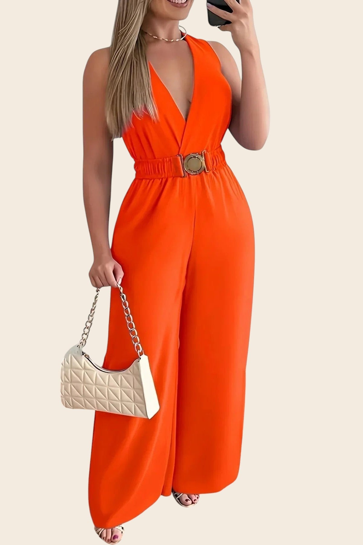 Combinaison femme orange vif Maison de la Combi, col V, ceinture dorée, pantalon palazzo, polyester et coton.
