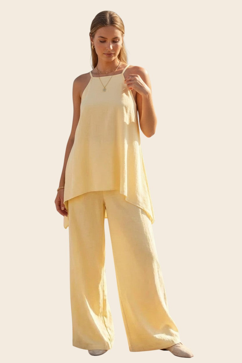 Combinaison jaune pastel maison de la combi en viscose fluide avec bretelles fines et pantalon palazzo large